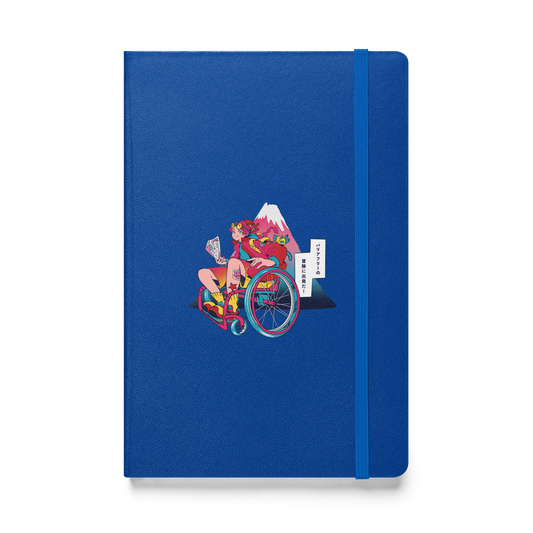 A blue notebook features an illustration of a person in a wheelchair holding a map, with Mount Fuji in the background.