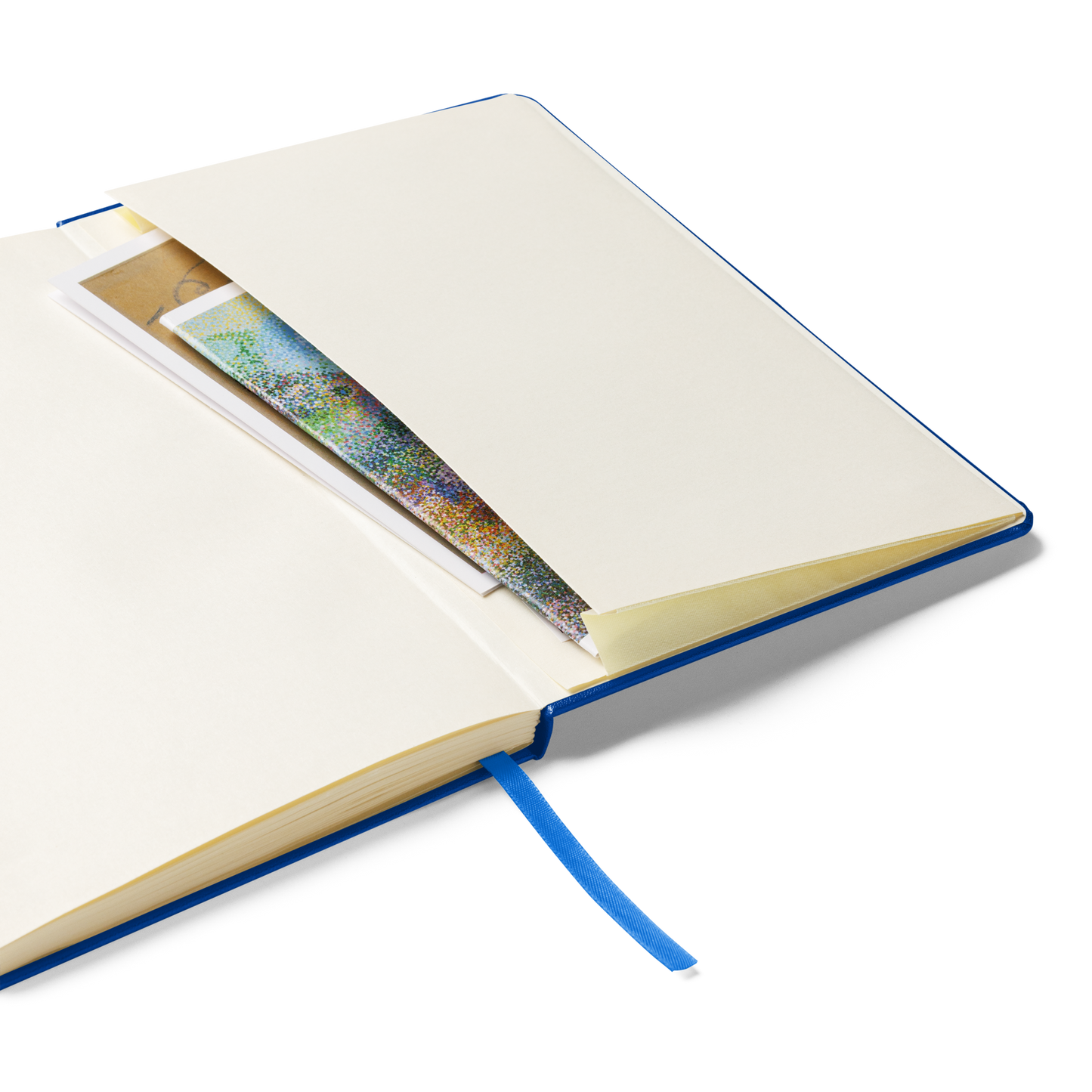 An open notebook showing an inner pocket containing papers, with a blue ribbon bookmark hanging out.