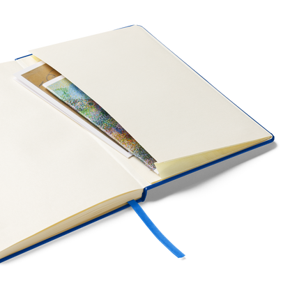 An open notebook showing an inner pocket containing papers, with a blue ribbon bookmark hanging out.